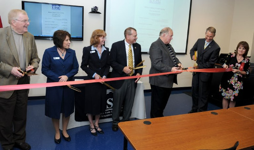 President Brian Noland, Mayor Fred Phillips, and other university and government leaders cut the ribbon at the ETSU at Kingsport Downtown Grand Opening - September 27, 2013