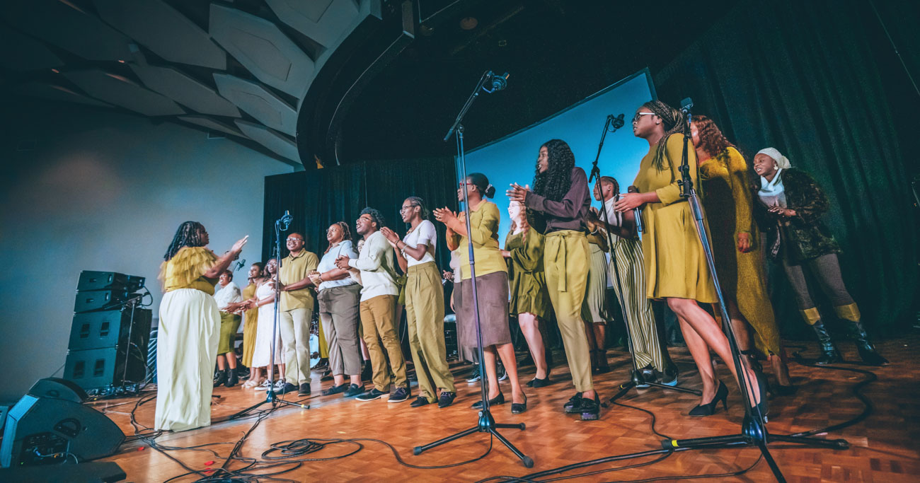 A photo of the Gospel Choir singing on stage.