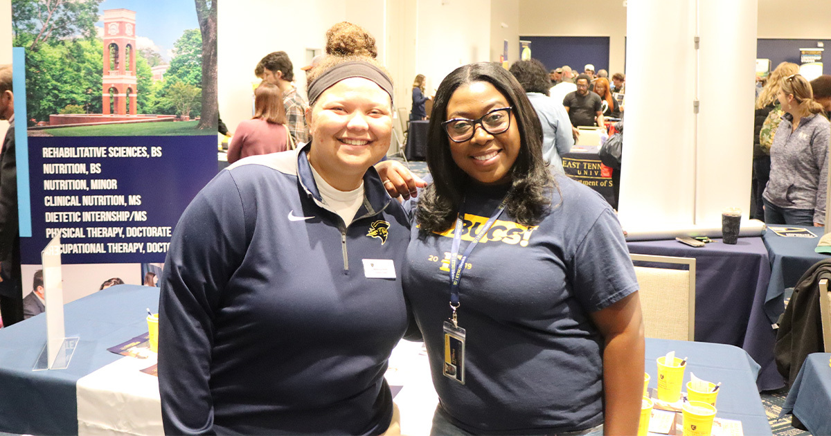 Dr. Dunkley and a student attend an Open House event.