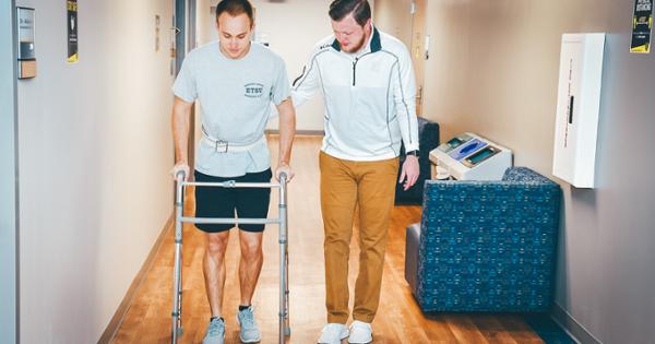 ETSU occupational therapy students practicing how to help people using a walker
