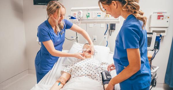 ETSU nursing students working on a manikin patient and taking vitals