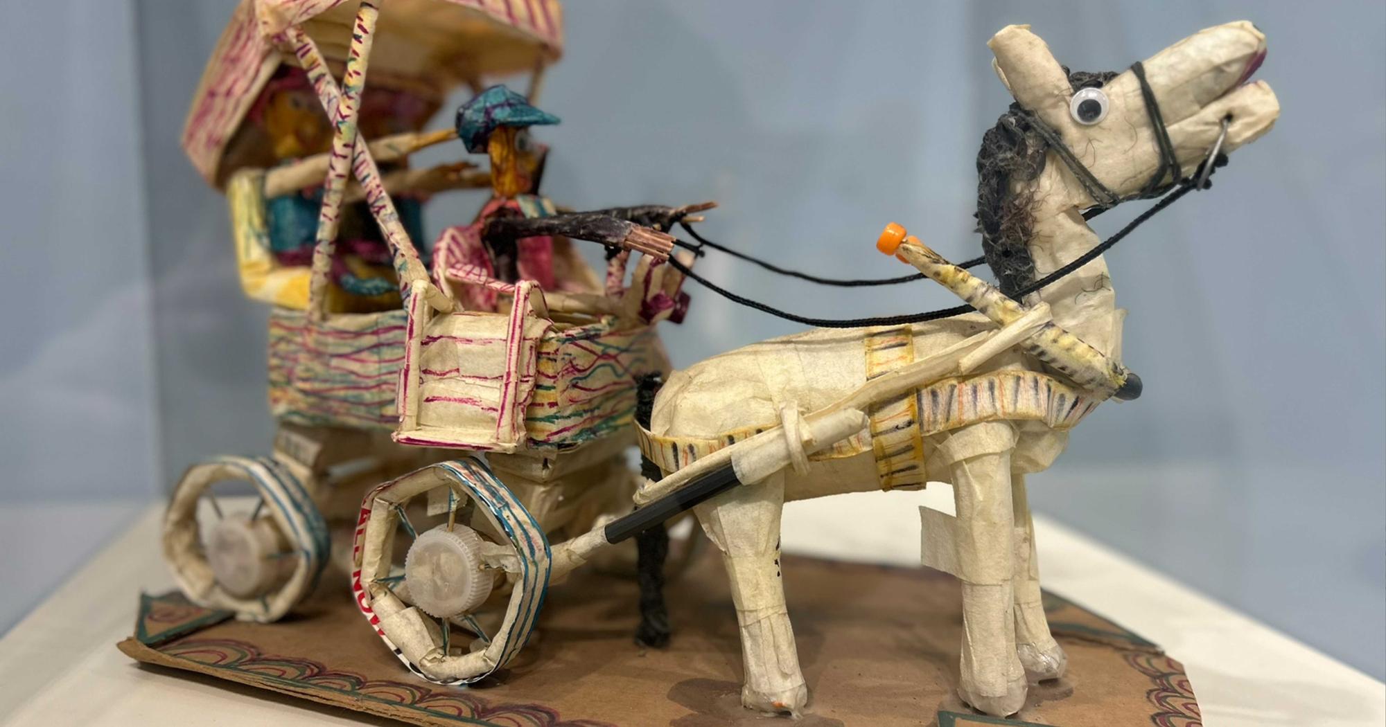 Close up of horse and cart made of tape.