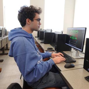 Students taking notes for stats.