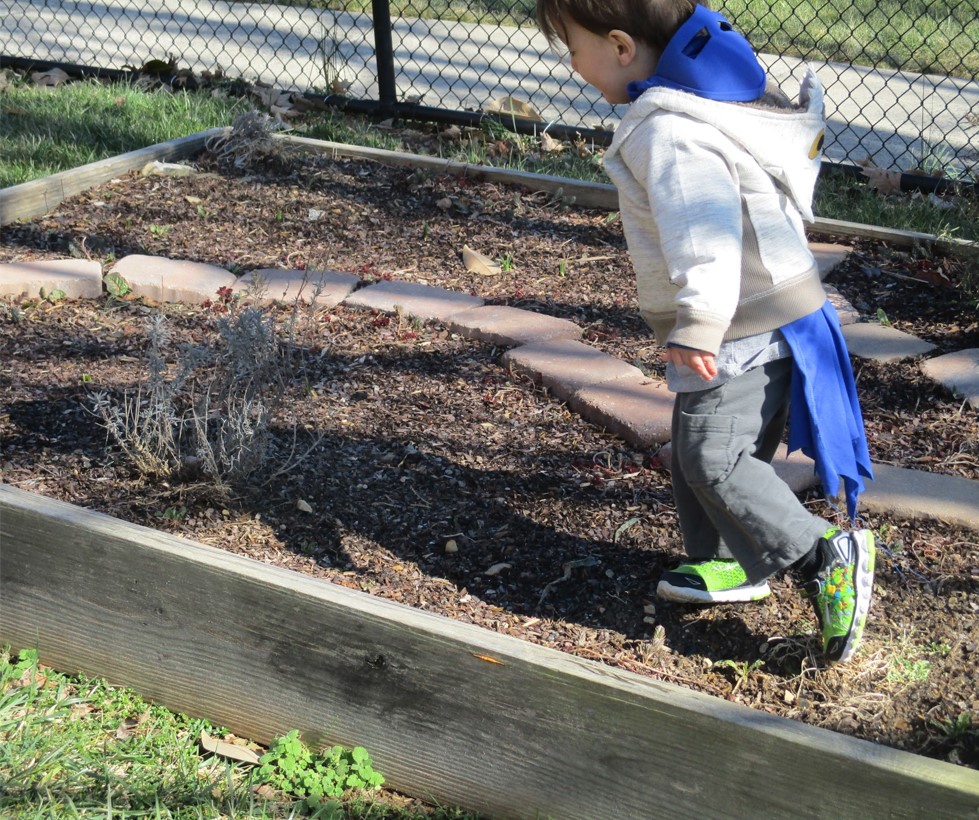 child playing in outdoor classroom