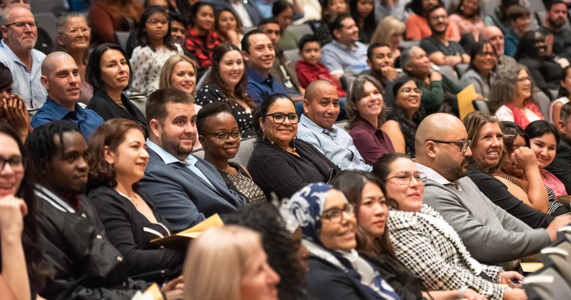 The crowd looks on at a naturalization ceremony.