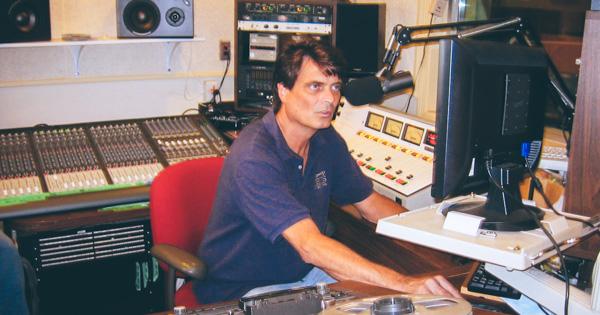 Wayne Winkler works at the WETS-FM control board