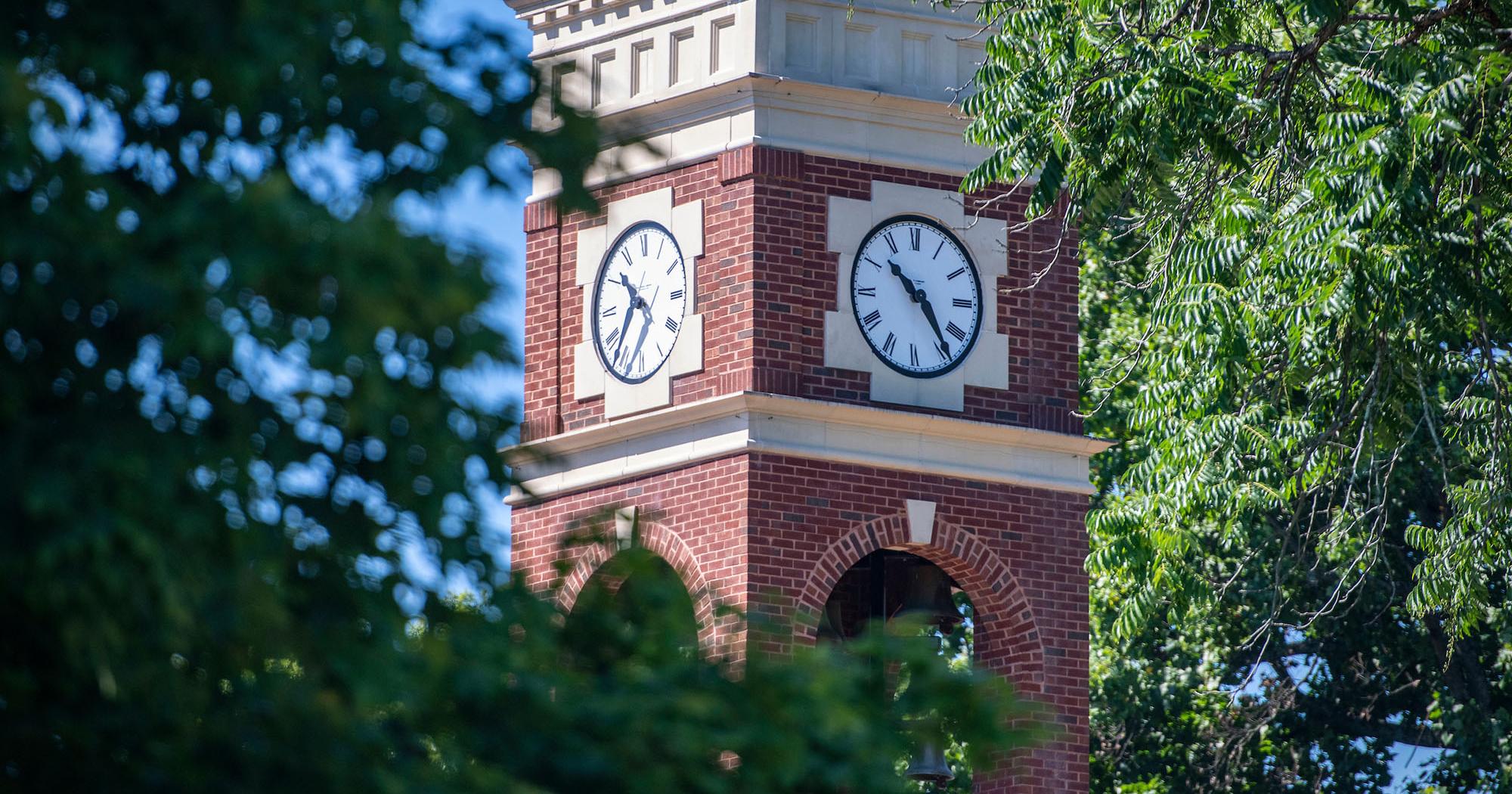 The ETSU belltower, surrounded by trees.