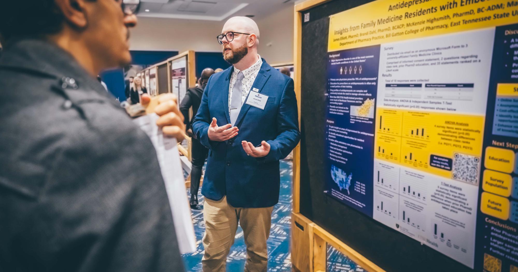 A student presents research in the D.P. Culp Student Center.