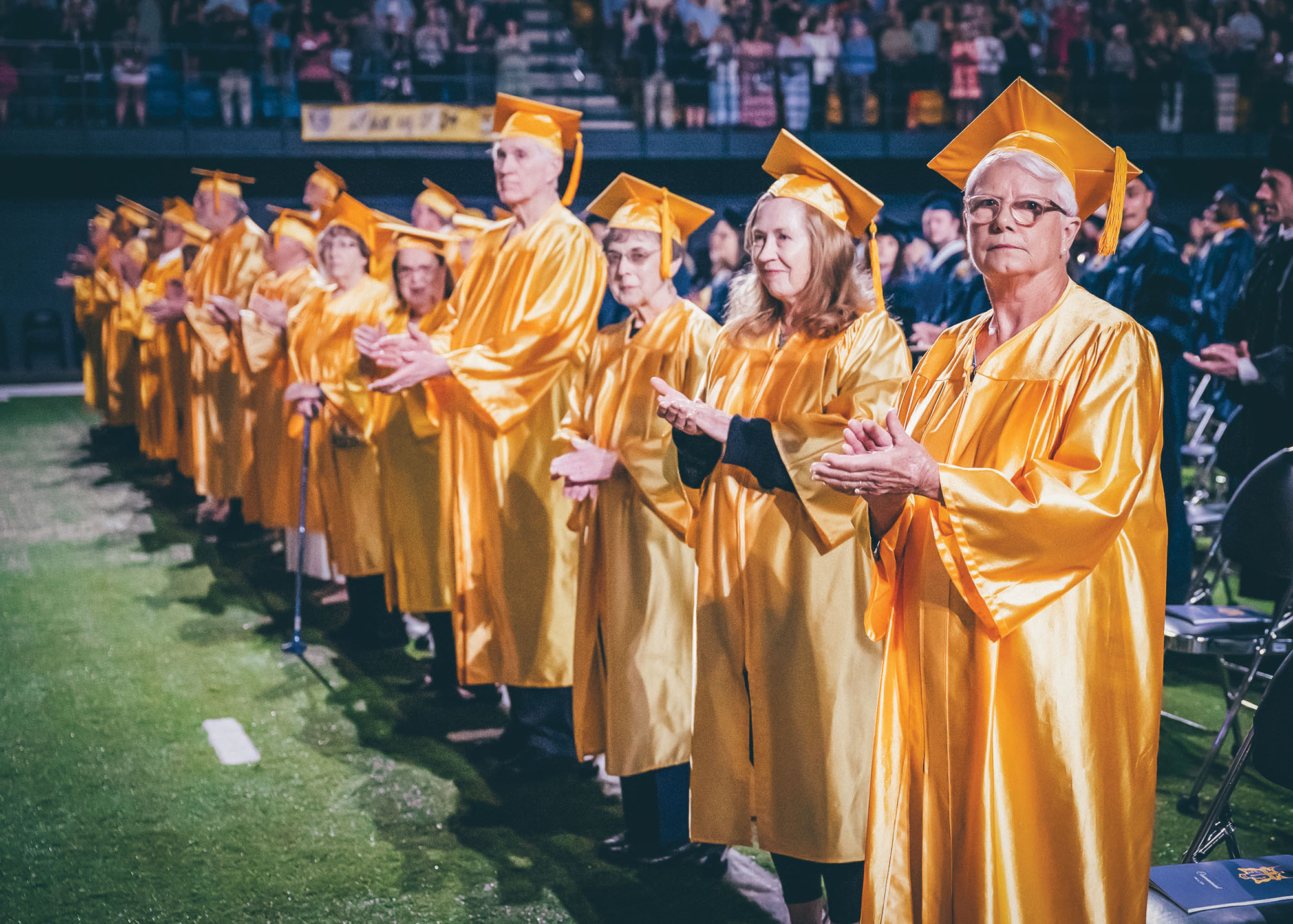 Members of the Golden Fifties Club clap at Commencement.