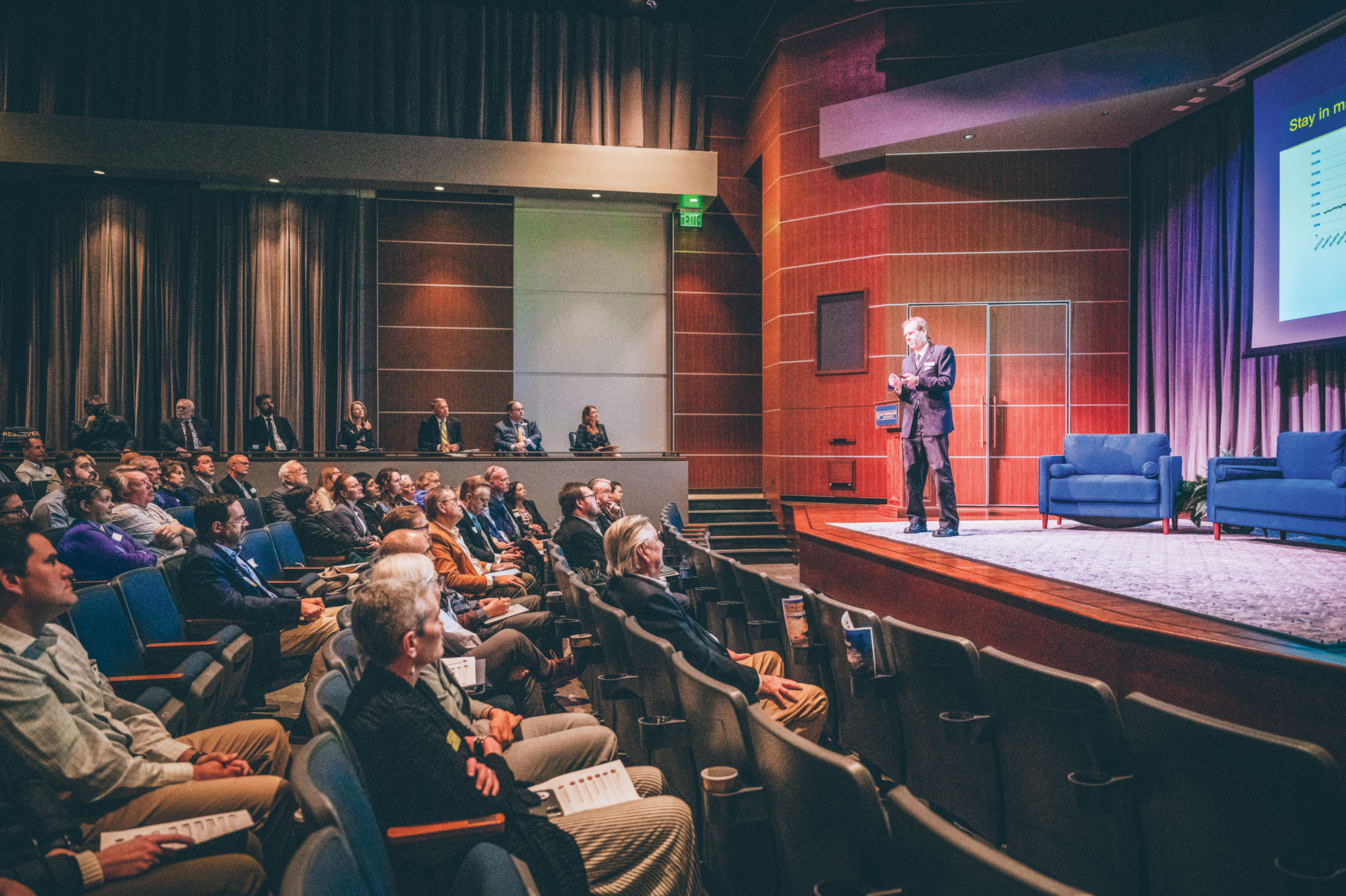 A presenter on stage at the 2024 Appalachian Highlands Economic Forum at the Martin Center for the Arts.