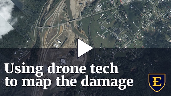 YouTube thumbnail depicting an overhead view of the flood damage. The text reads "Using drone technology to map the damage.""