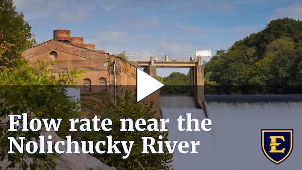 YouTube thumbnail depicting water flowing over the Nolichucky Dam. The text reads "Flow rate near the Nolichucky River."